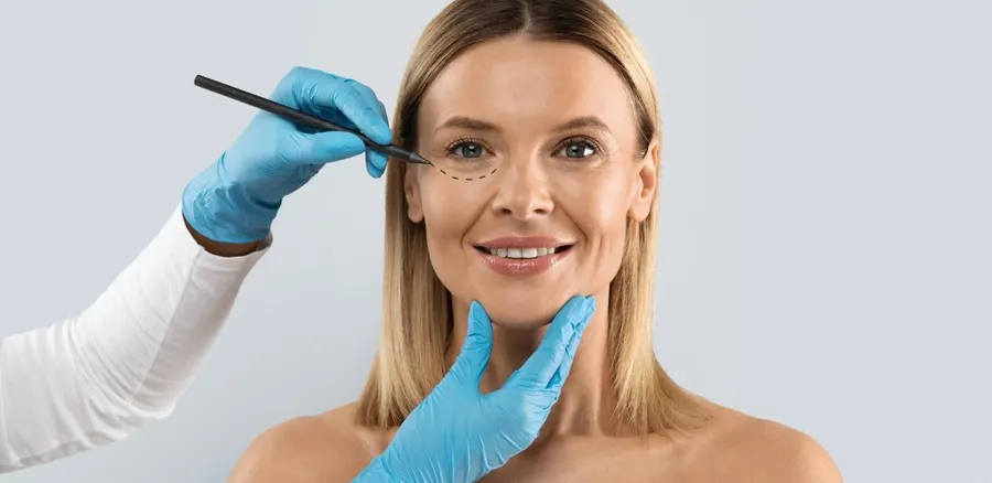 Aesthetic consultation, marking treatment areas on a patient’s face